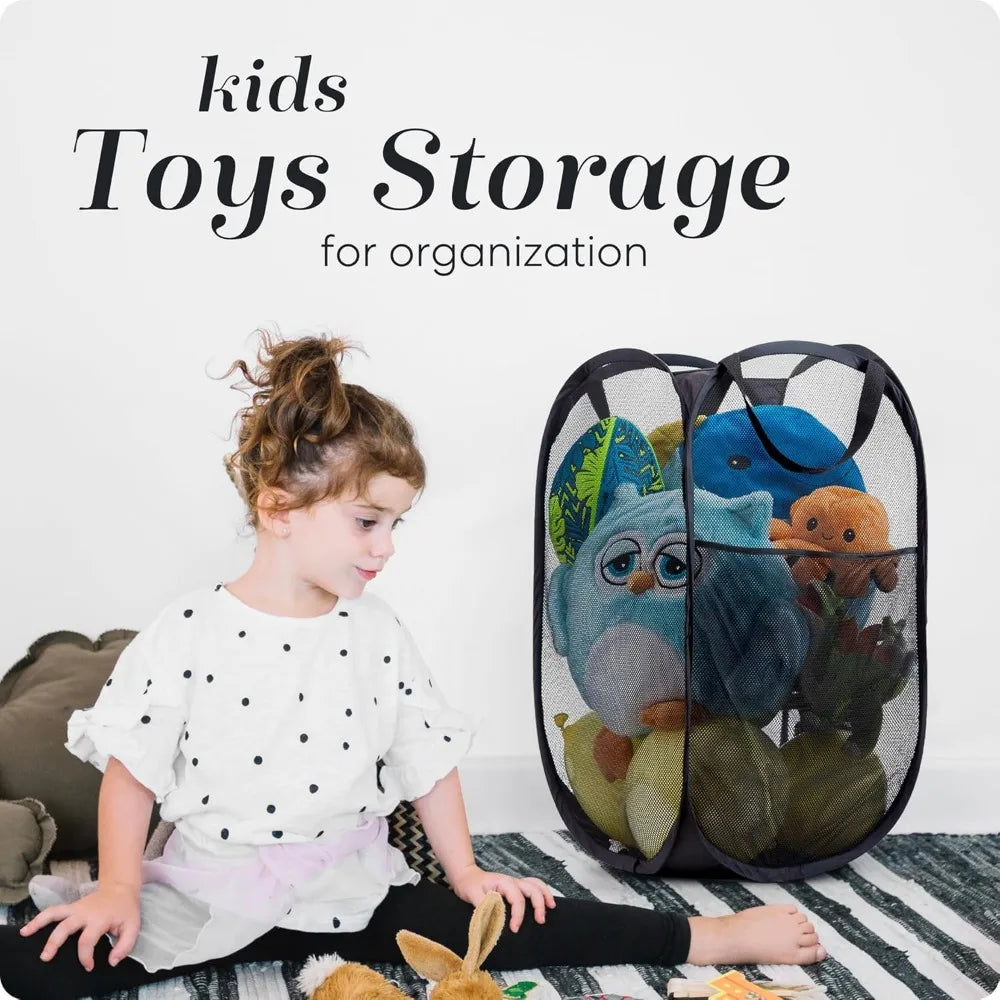 Black mesh laundry bag filled with plush toys on a bed besides a young girl.