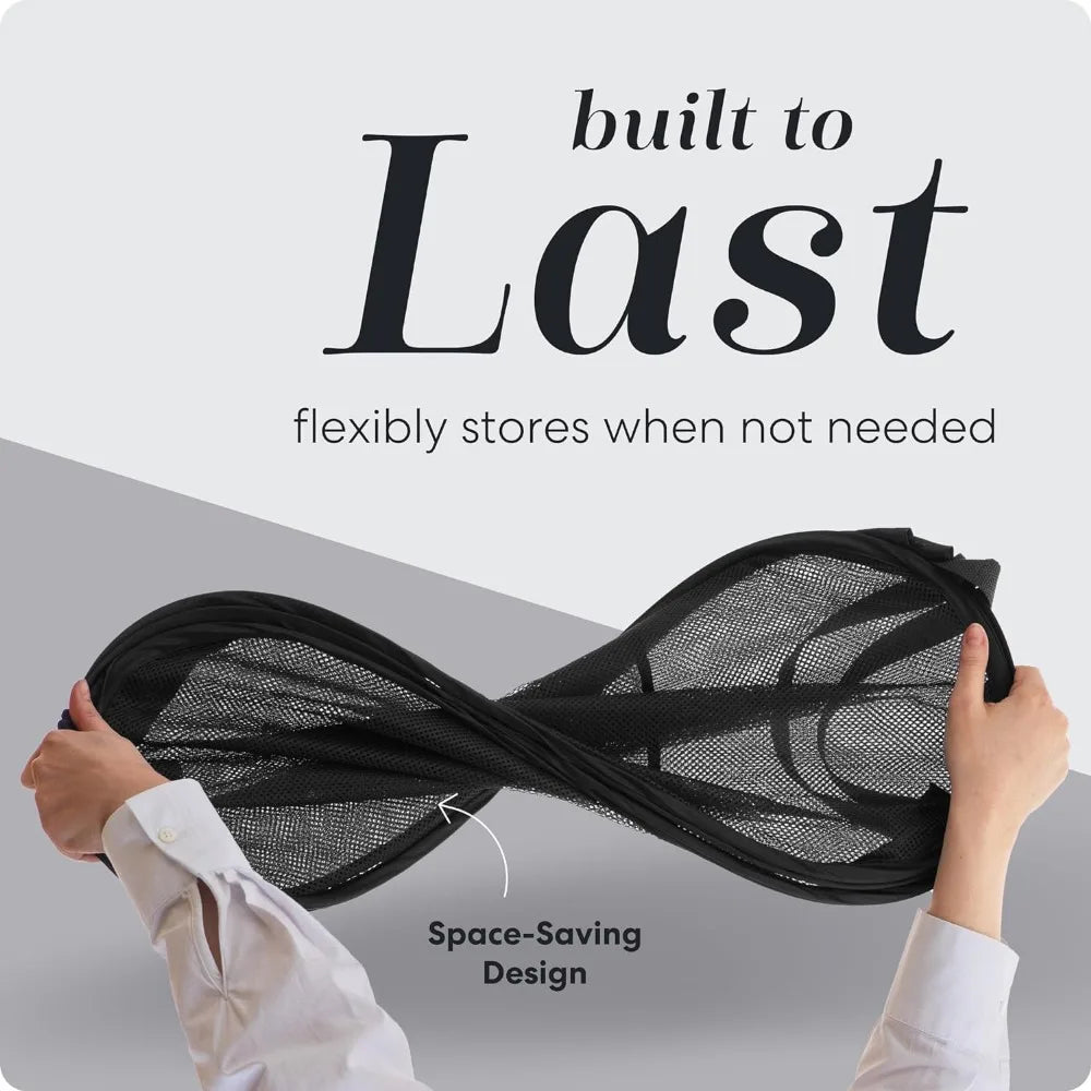 Black mesh laundry bag with reinforced handles, held by a hand, built to last