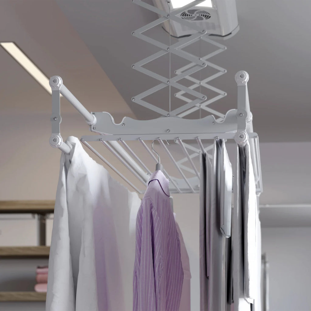 Ceiling-mounted clothes dryer with hanging clothes in a room.