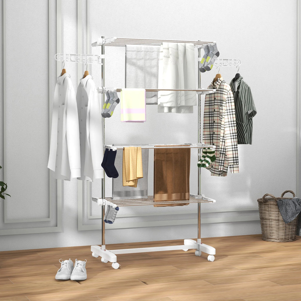 Clothing rack with clothes on a wooden floor against a white wall
