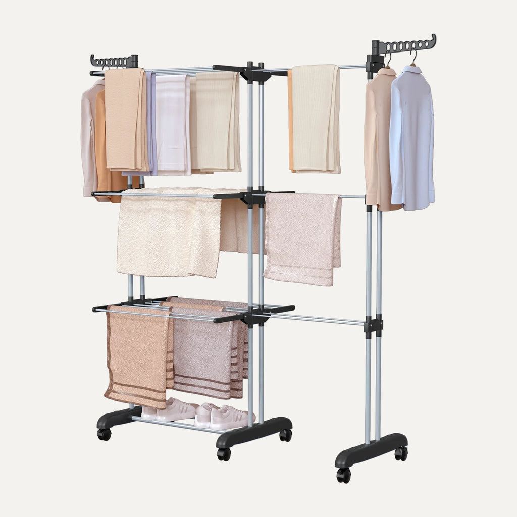 Clothing rack with multiple garments on a white background