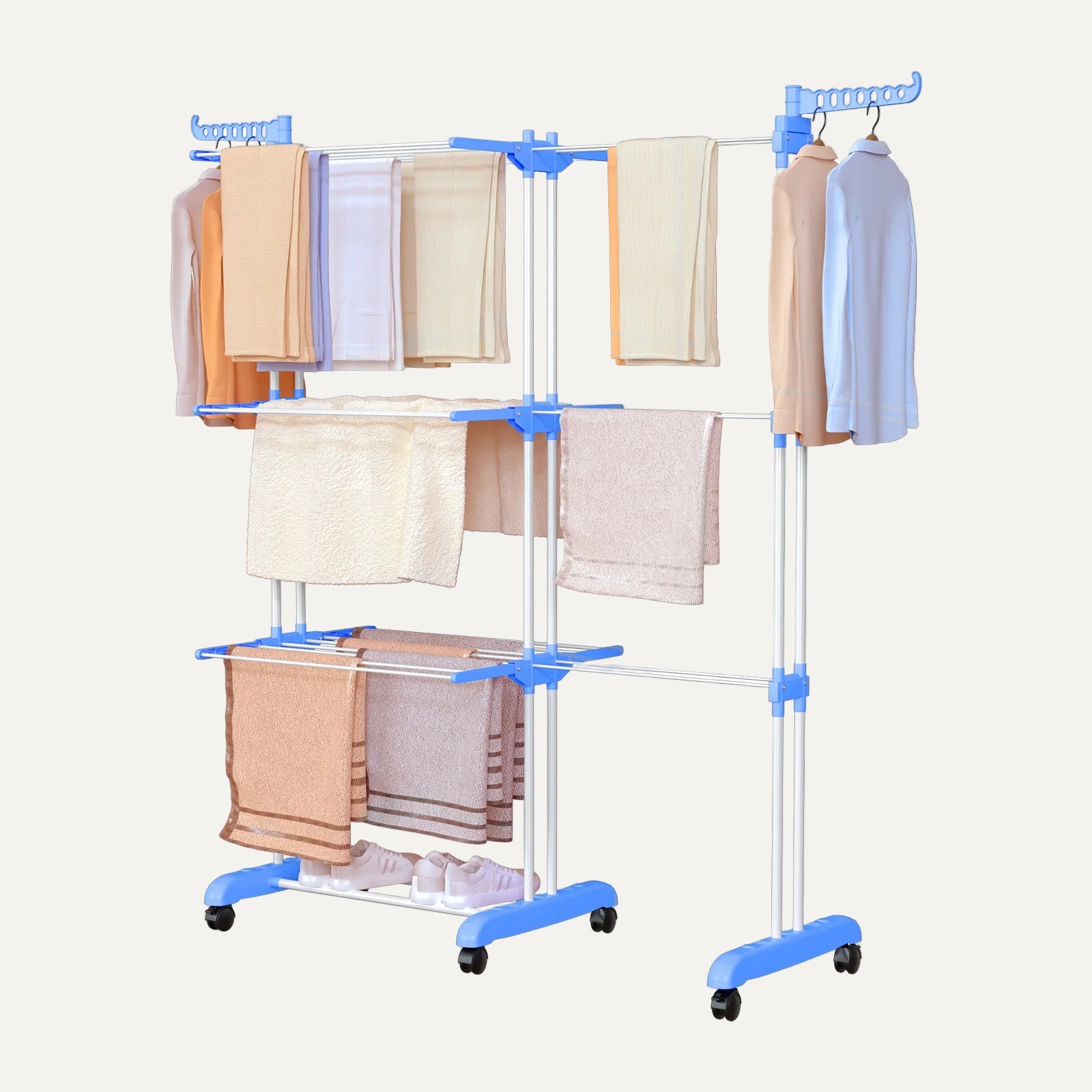 Clothing rack with multiple pairs of pants hanging on it against a white background