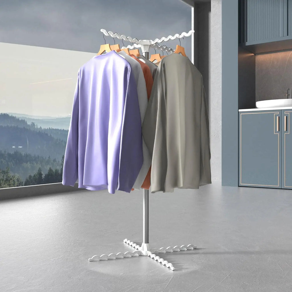 Clothing rack with three shirts in a room with a view of trees