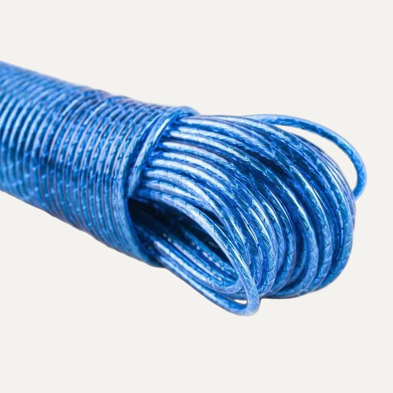 Coiled blue clothes line rope that doesnt leave stains on a white background
