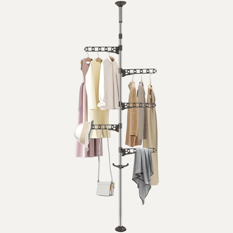 Floor to Ceiling Clothing rack with clothes and bags on a white background