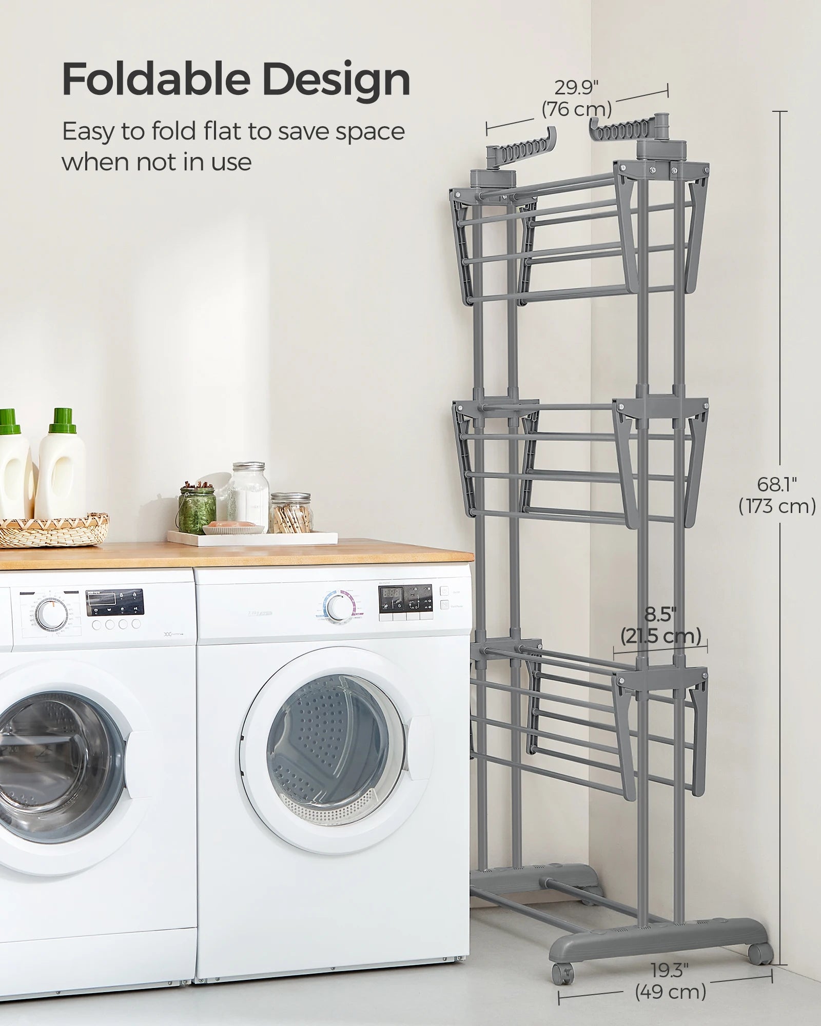 Foldable drying rack next to a washing machine with dimensions displayed