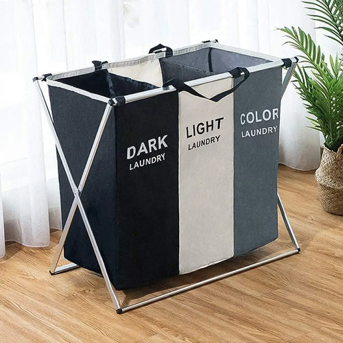 Foldable laundry bag with labels for dark, light, and color laundry in a room environment.