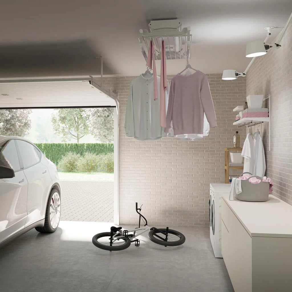 Garage with car, bicycle, and laundry hanging on a clothesline.