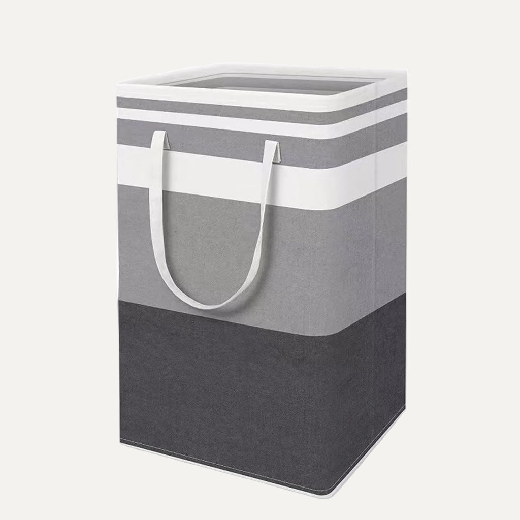 Gray and white striped laundry basket with handles on a white background