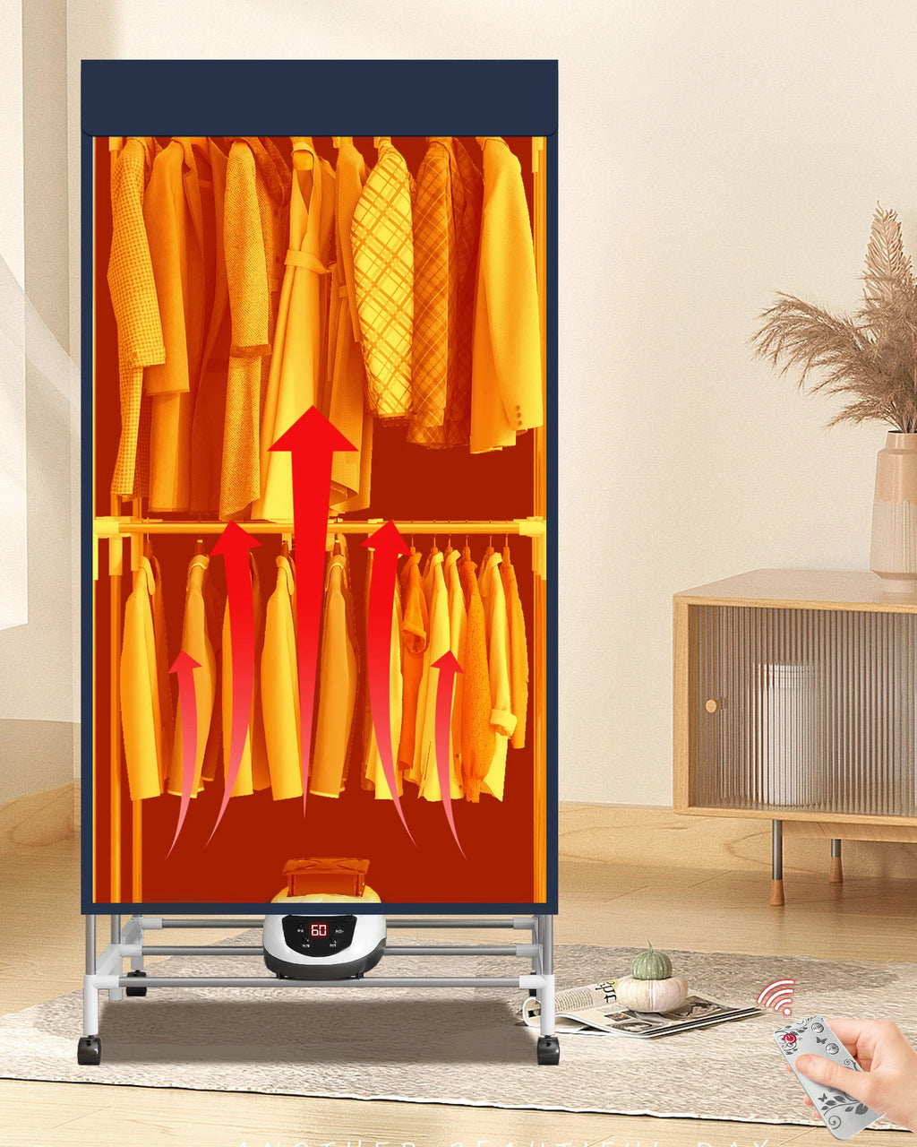 Heated clothing dryer with clothes inside, showing a hand using a remote control in a room setting.