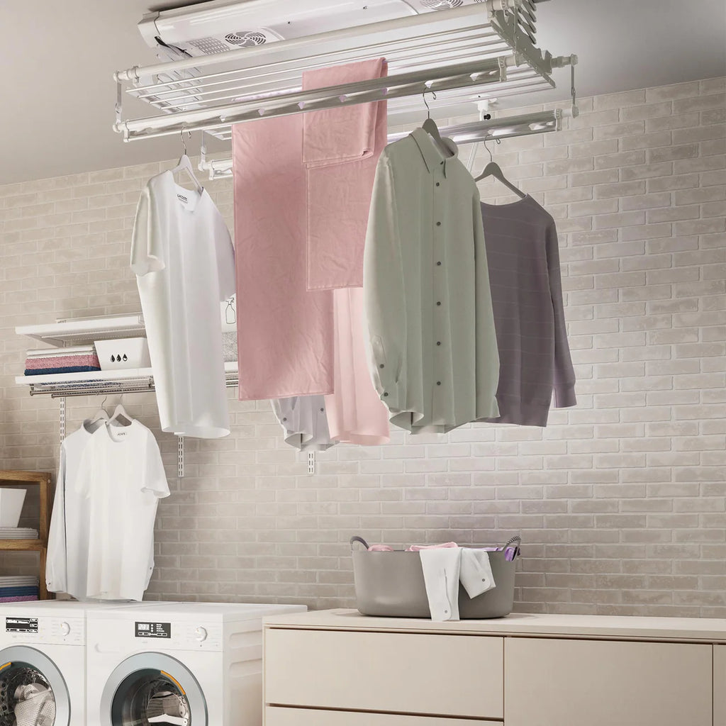 Laundry room with clothes hanging on a Ceiling Mounted Smart Electric Clothes Airer and washing machines in the background.