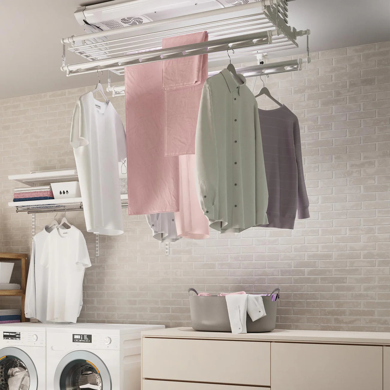 Laundry room with clothes hanging on a Ceiling Mounted Smart Electric Clothes Airer and washing machines in the background.