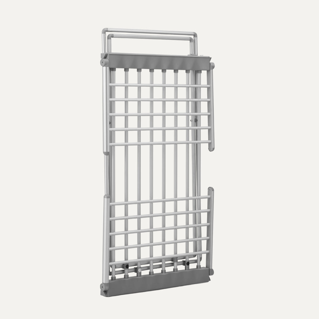 Metal grid (folded heated drying rack) with handle on a white background
