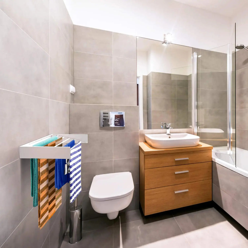 Modern bathroom with wooden vanity, toilet, and towel rack/airer.