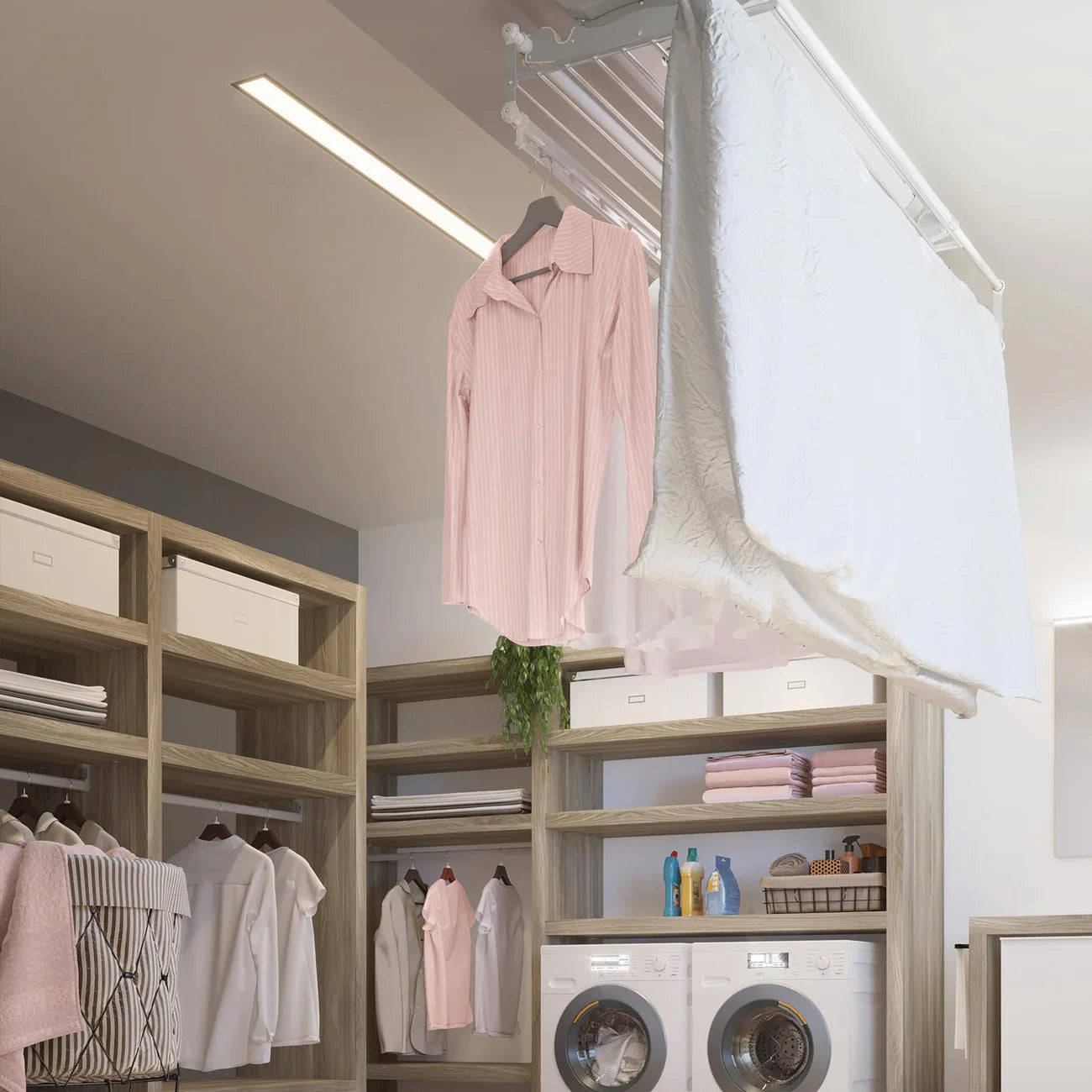 Modern laundry room with shelves, washing machines, and clothes hanging on a smart ceiling clothes dryer/airer