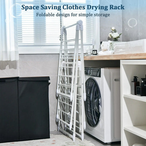 Space-saving clothes drying rack/airer in a laundry room with washing machine and dryer.