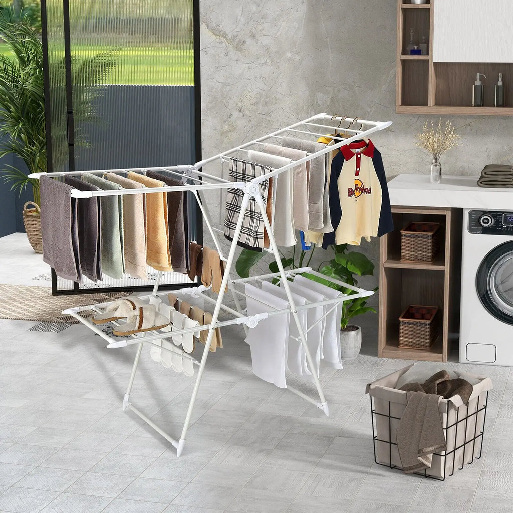 White drying rack/airer with clothes in a laundry room.