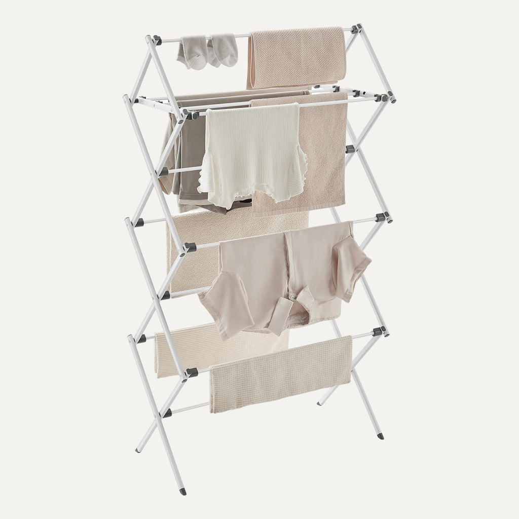 White metal drying rack/airer with clothes on it on a white background
