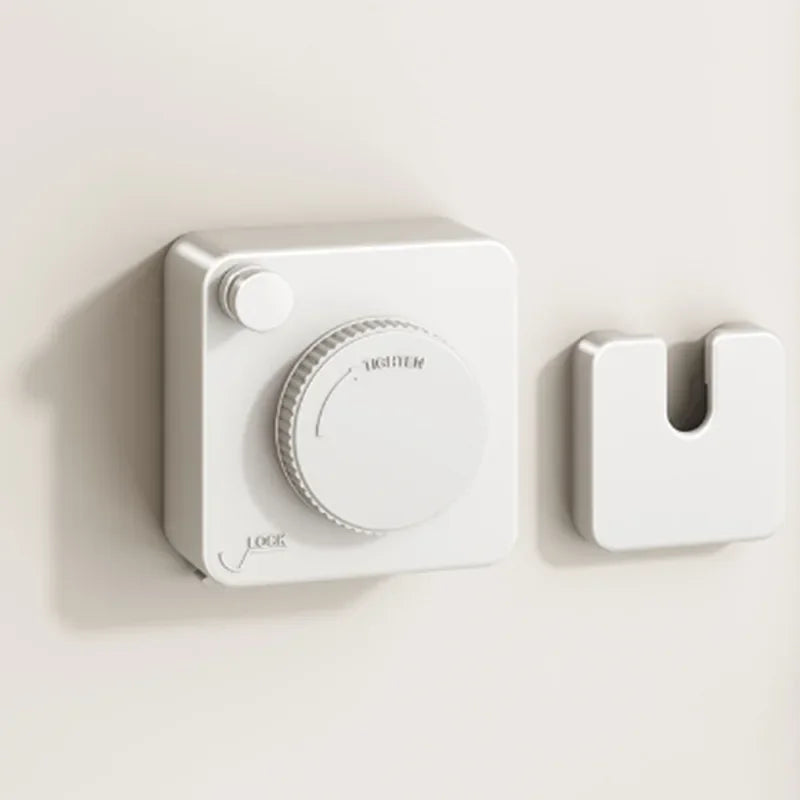 White retractable clothesline mechanism on a beige background