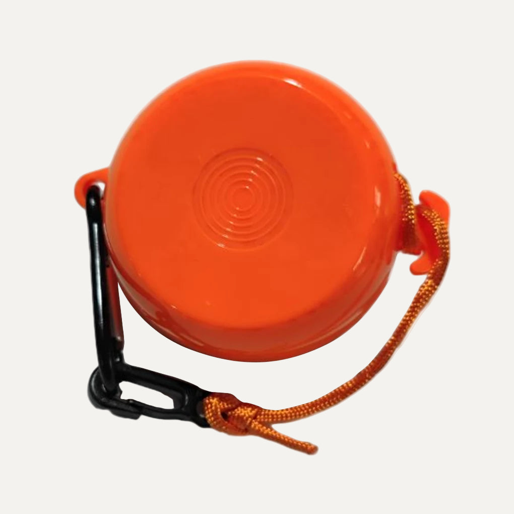 the orange back of a retractable clothesline rope with carabiner on a white background